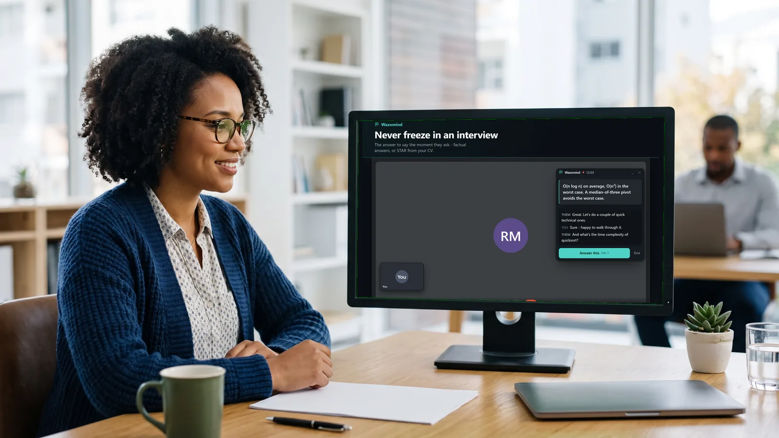 A recruiter running a video interview with Wazomind beside the call